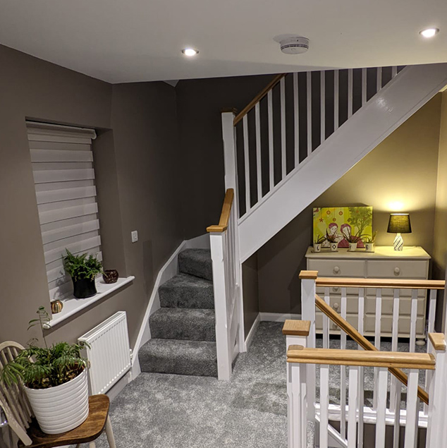 Carpeted corner stairwell in loft ocnversion