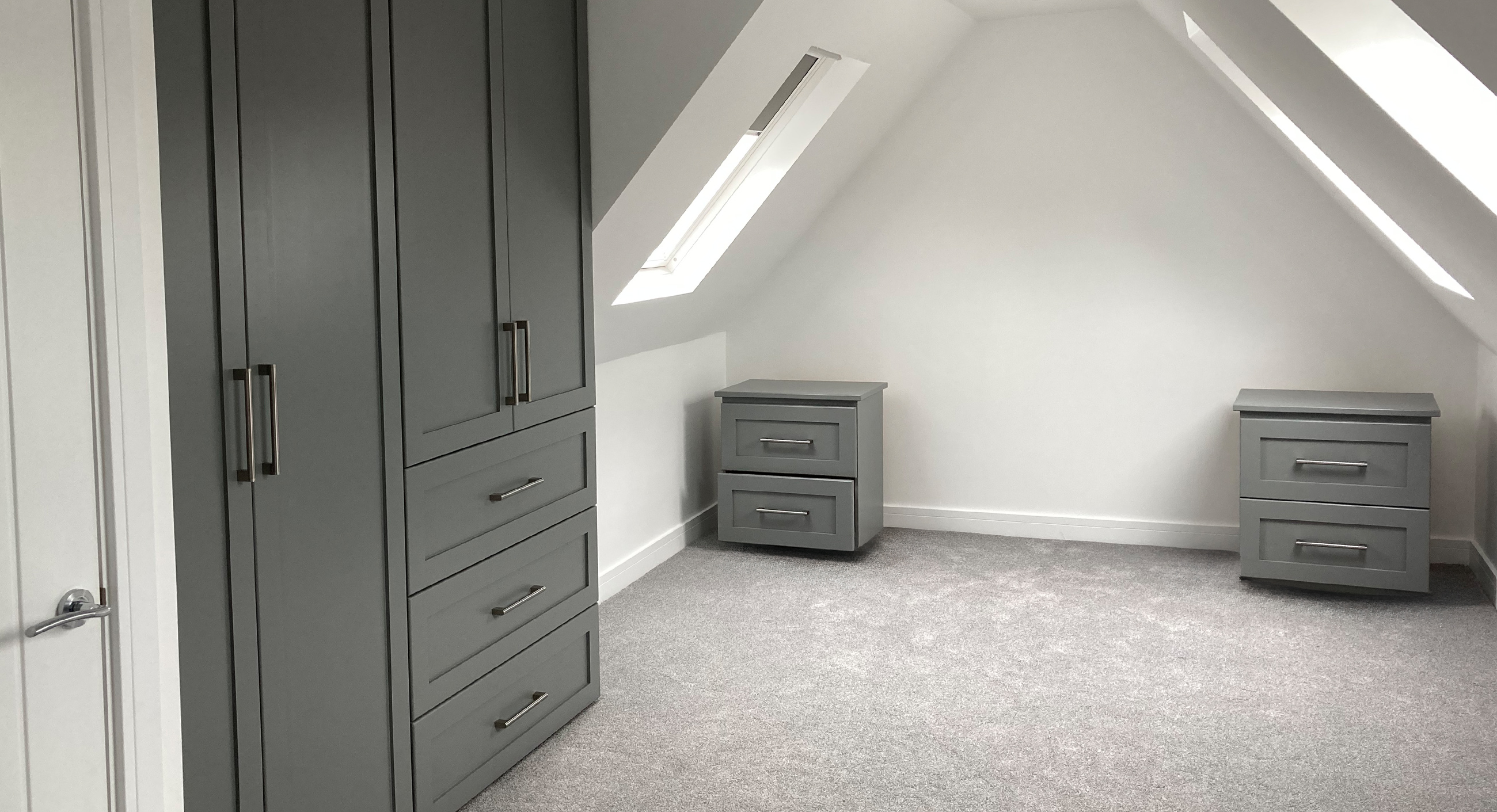 Minimalist bedroom loft conversion with Velux window